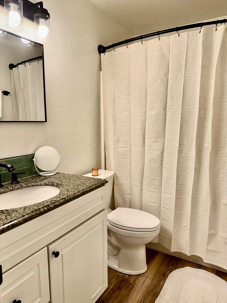 Freshly painted bathroom with new hardware and toilet. Shower/tub combo.