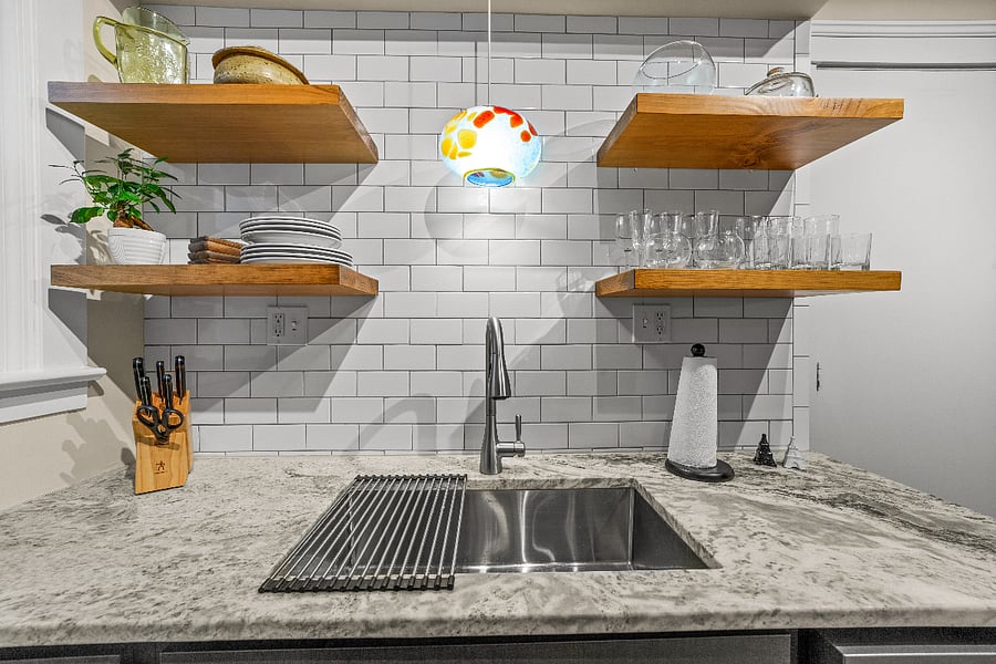 Custom floating shelves and hand-blown glass pendent from the Glass Bubble Project in the Market Square Historic District