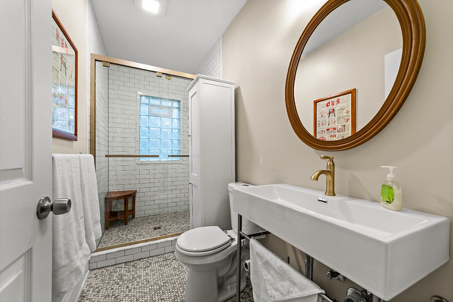 Penny tile floor throughout bathroom is non-slip and massages your feet
