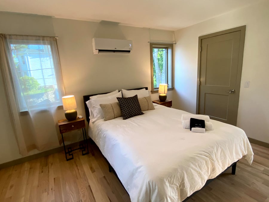 Bedroom #3 on the 2nd floor with a queen bed and a full bathroom with a standing shower connected.