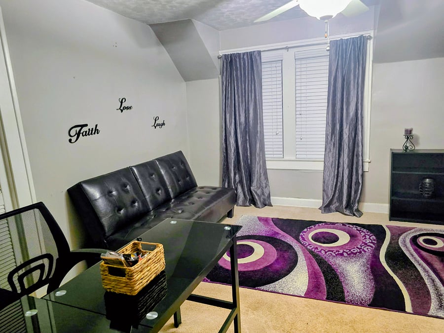 Upstairs bedroom with futon and rolling bed. May also be used as office. 