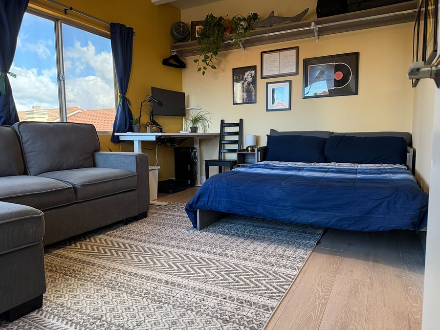 Queen bedroom with office space, ensuite, and private balcony