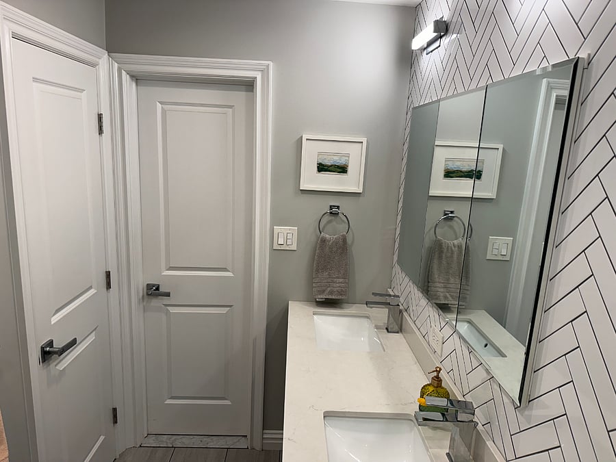 1 door leads to hallway, one door leads to master bedroom.