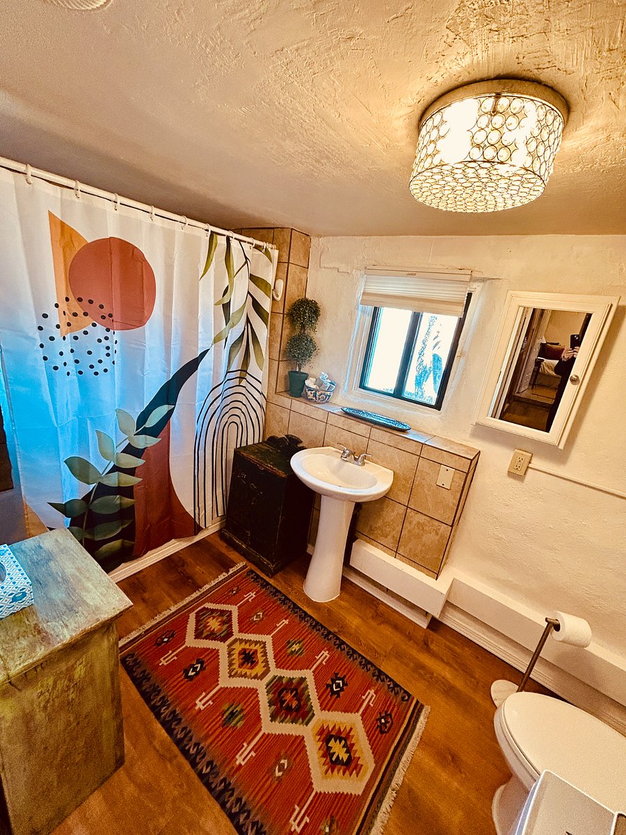 Spacious bathroom located off king room with a small step down.