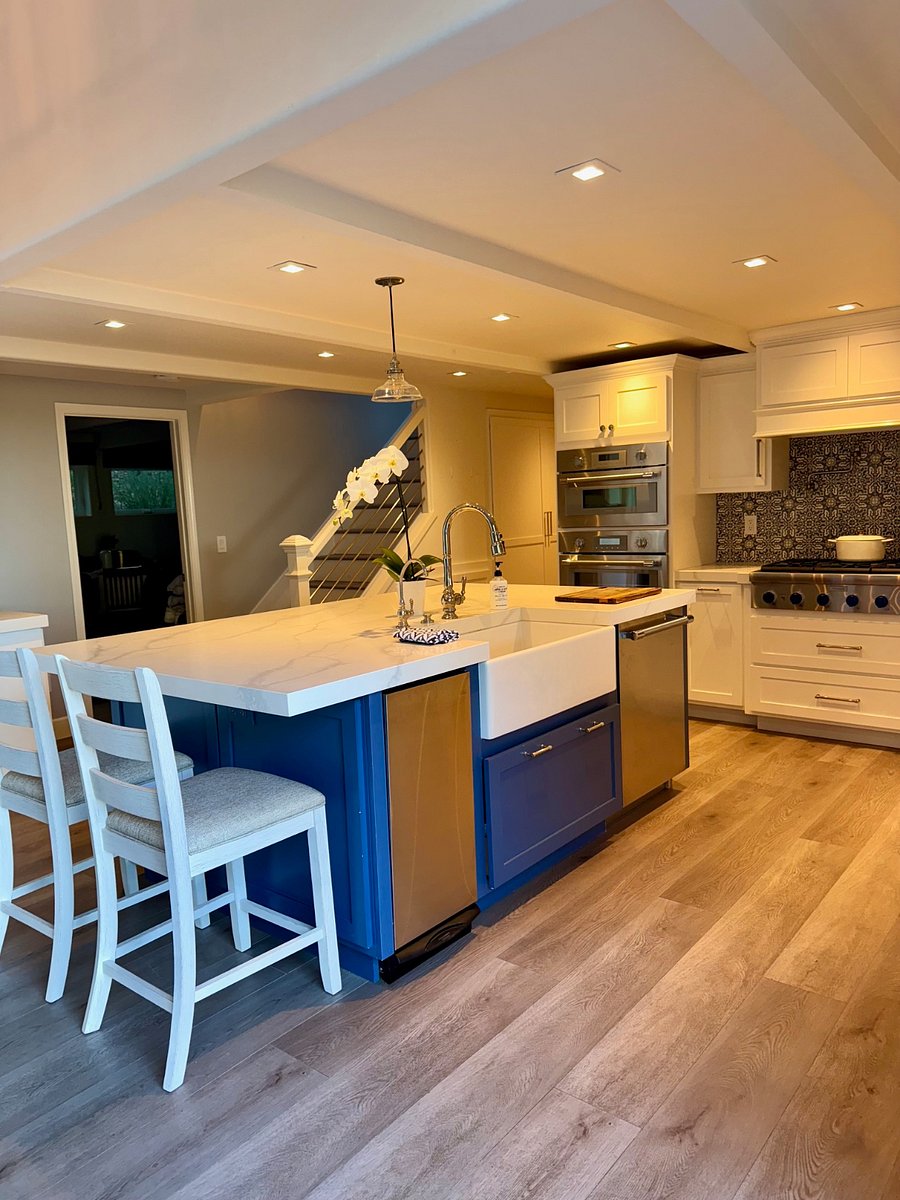 Large kitchen Island with deep apron sink, dishwasher and trash compactor