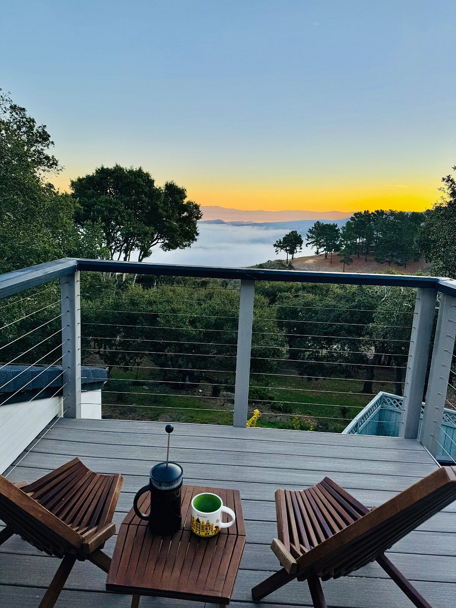 Enjoy your coffee with sunrise views through the soaring oaks from your master suite deck
