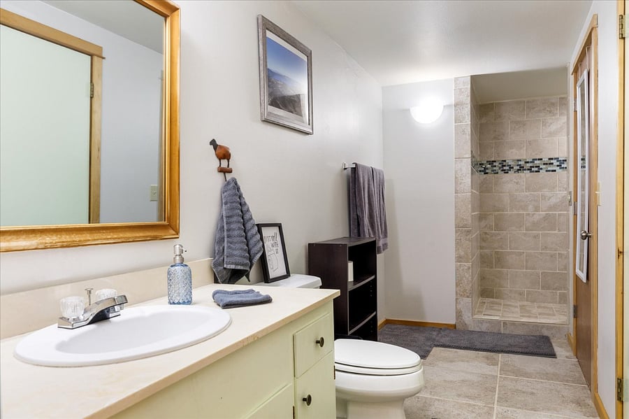 Laundry room is that door on the right side with the mirror on it