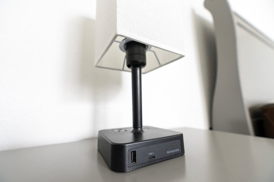 Usb-c, USB-a, 2 outlets and touch to turn on lamp.