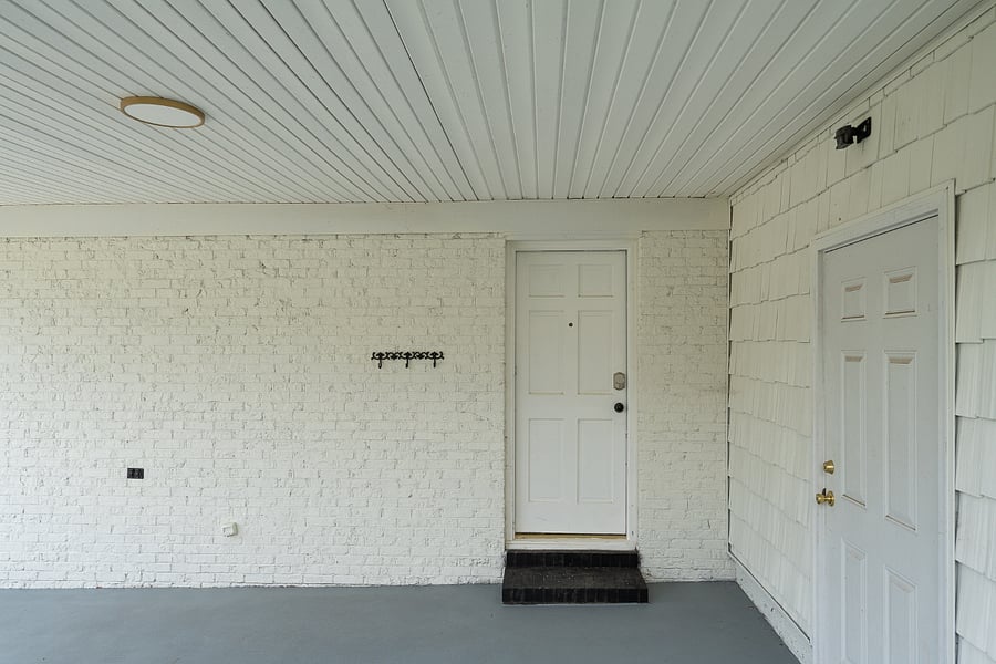 This door in the carport has a Schlage smart lock.  There a couple cameras on the front and back of the house, outside only. 