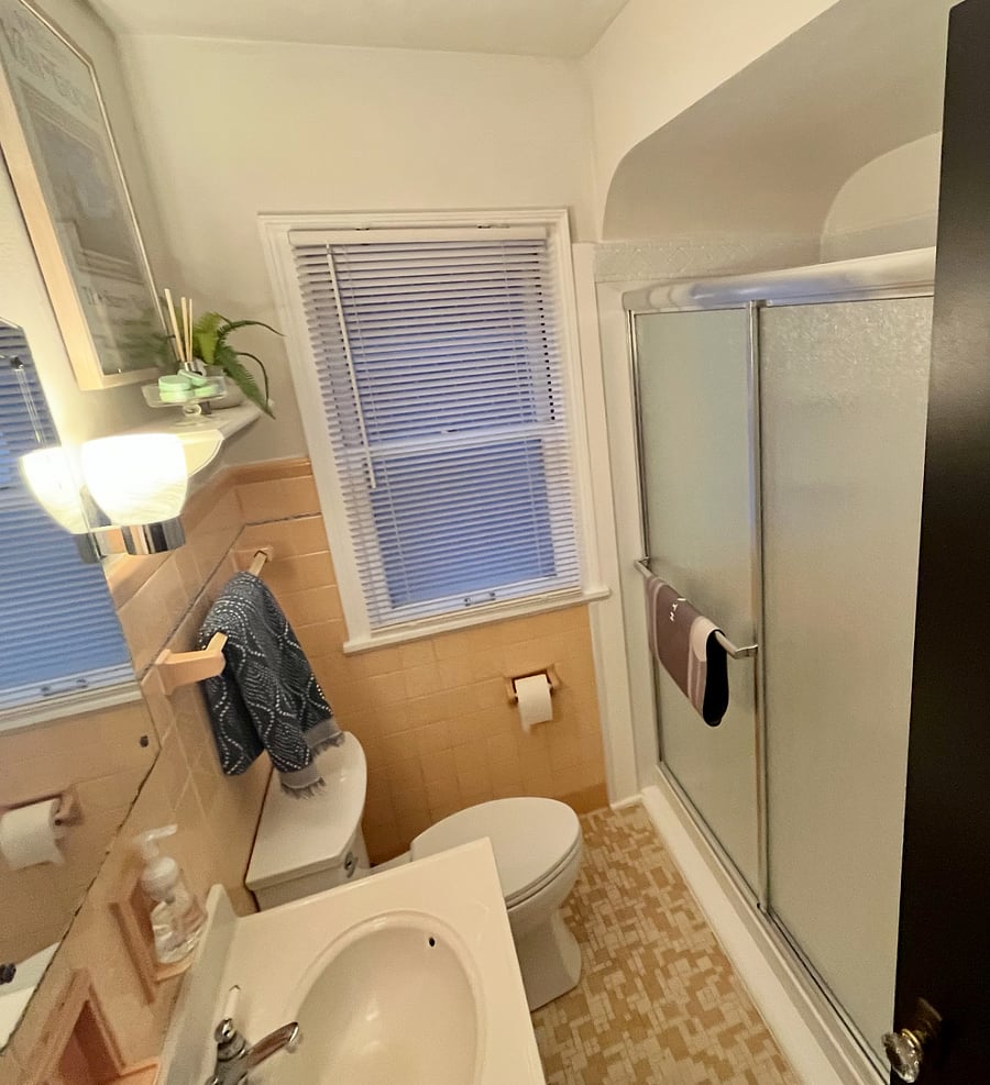 Discover the timeless charm of our bathroom, blending old-world beauty and exquisite craftsmanship with modern upgrades. Indulge in the sleek walk-in shower and newly updated toilet, offering both elegance and contemporary comfort in this inviting Wauwatosa duplex lower level.