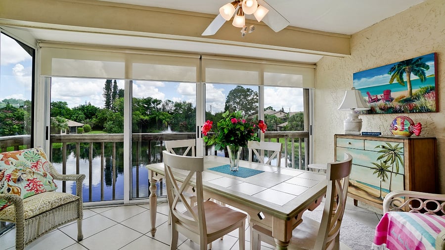 Table on screened in porch provided for work or play!