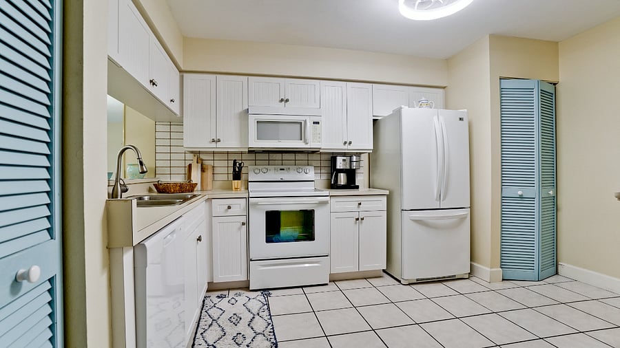 Full kitchen with dishwasher.