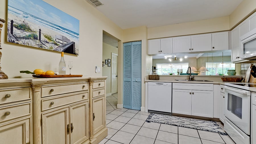 Full kitchen with dishwasher and coffee bar.