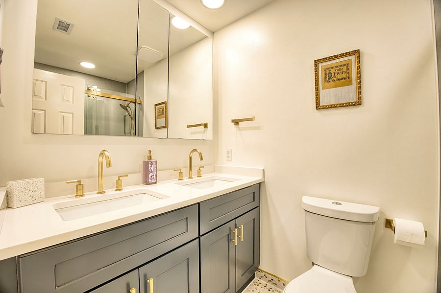 Central hall Bathroom with double vanity sinks