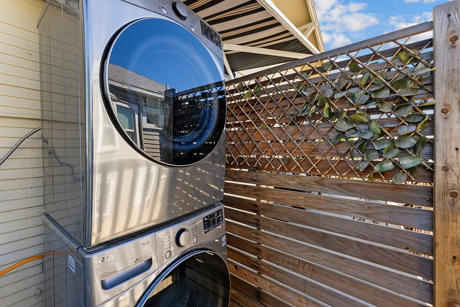 Stackable Washer/Dryer located on the deck. This WD is shared with the next door unit only. All other units have WD.