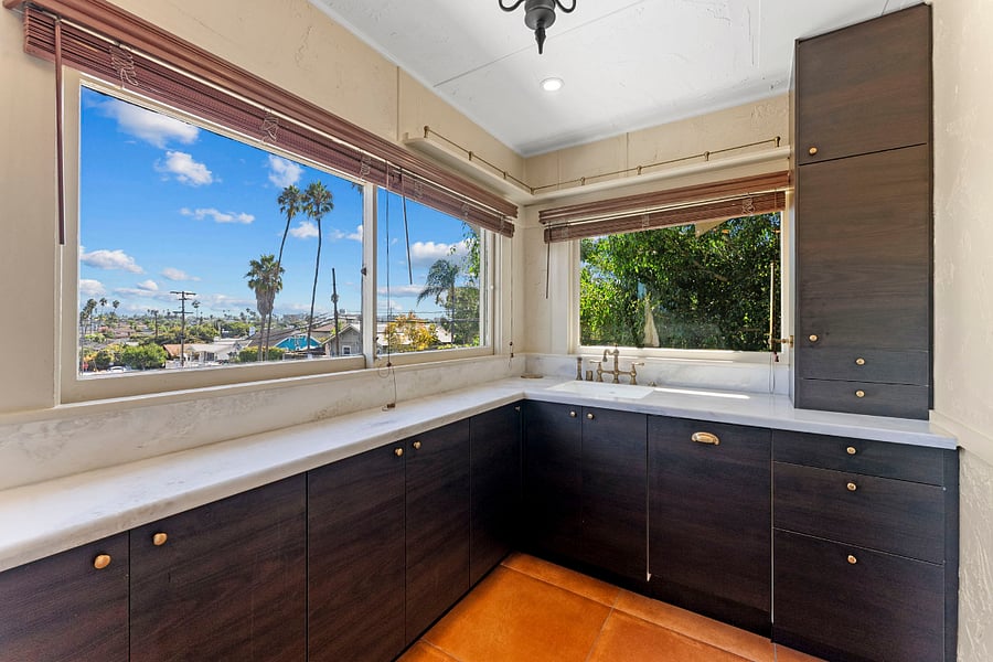 No one likes doing dishes, but if you have to, why not with a view! Dishwasher, cabinets for storage.