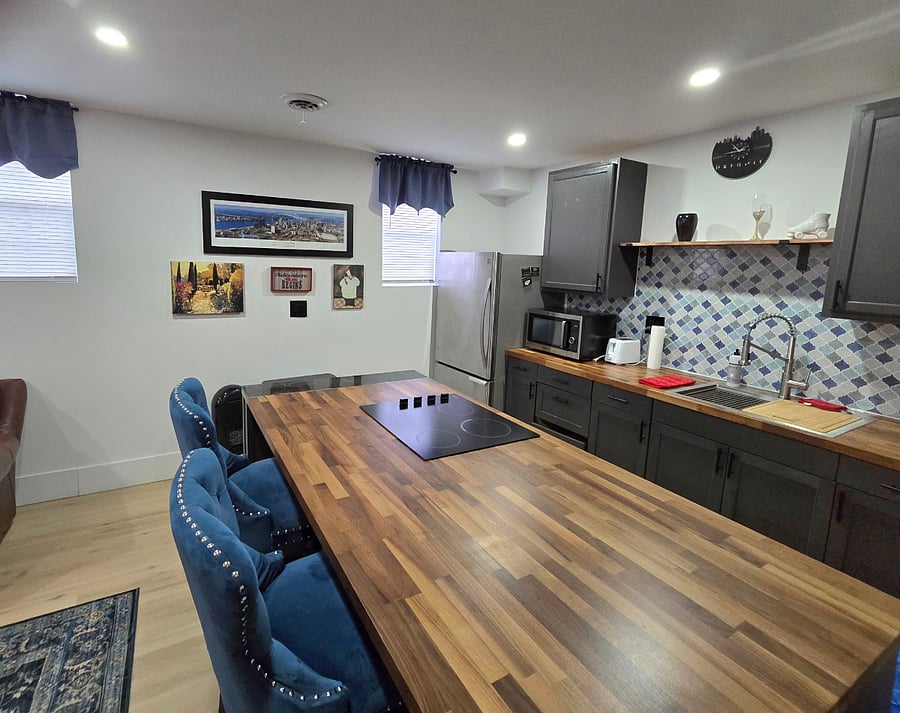 Kitchen with Full refrigerator, Microwave, and Toaster