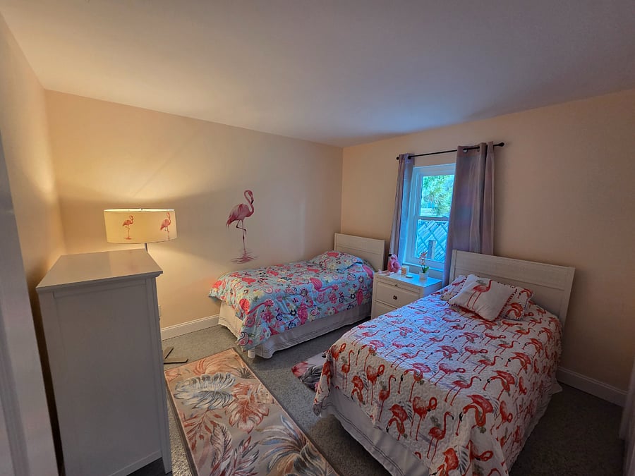 bedroom with 2 twin beds, dresser and large closet. 