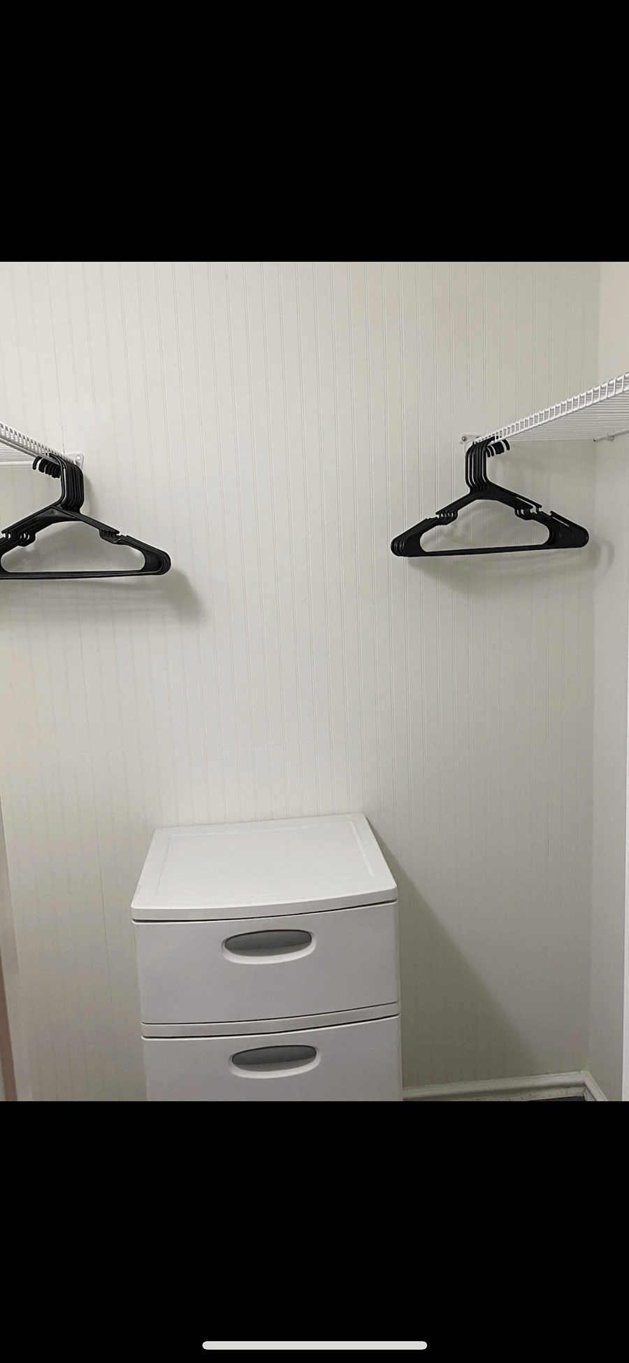 Walk in closet with hangers. Ready for you to unpack and hang your clothes up
