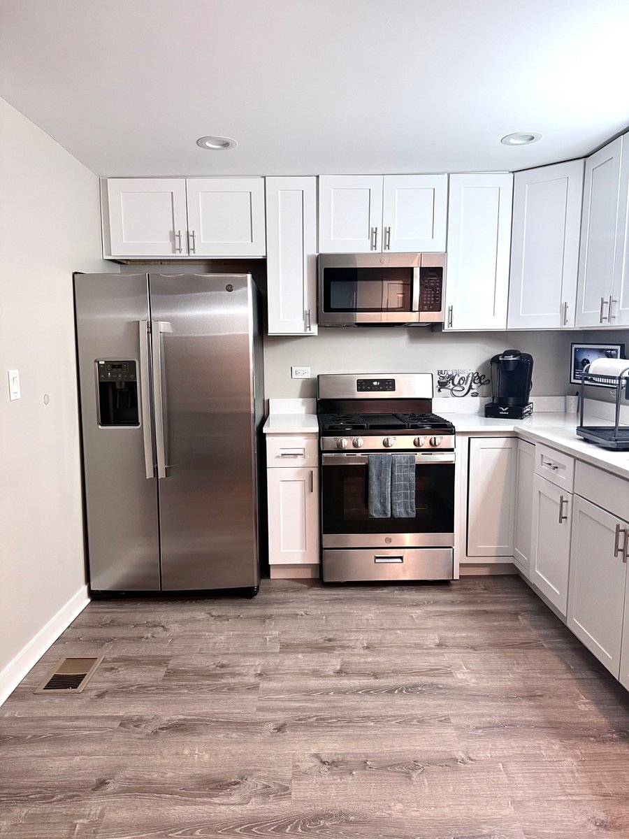 Fully equipped kitchen with stainless steel appliances, gas stove, Keurig coffee maker, and complete dish-ware for guest use. An Alexa Smart screen is available for music or streaming while you cook. Bright modern space designed for convenience. 