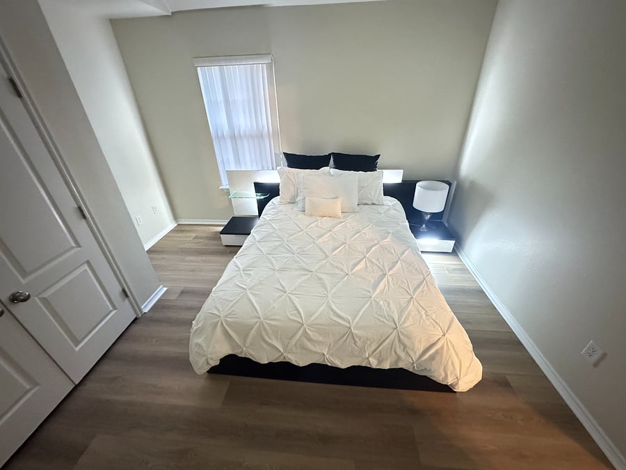 Private 3rd bedroom with smart TV, workspace, and comfortable queen bed.