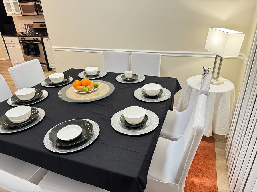Bright dining space with table and chairs for eight perfect for family meals or meetings.