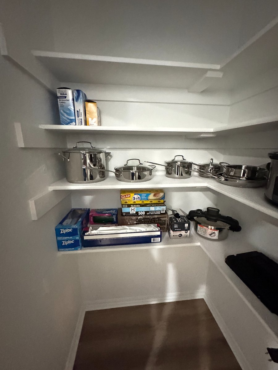 Fully stocked pantry with cookware, utensils, blender, slow cooker, and all the essentials for easy home cooking.