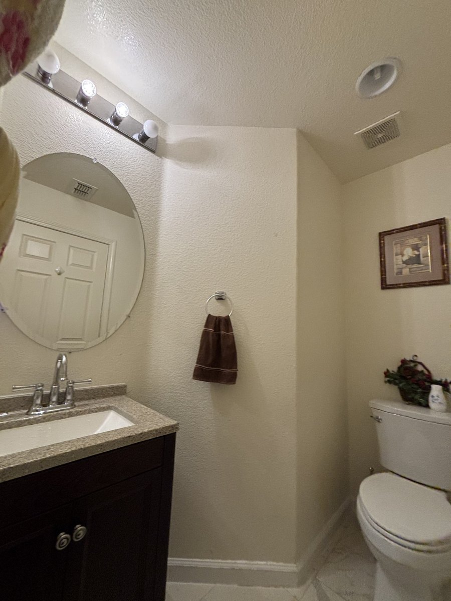 Half bathroom downstairs next to the kitchen.