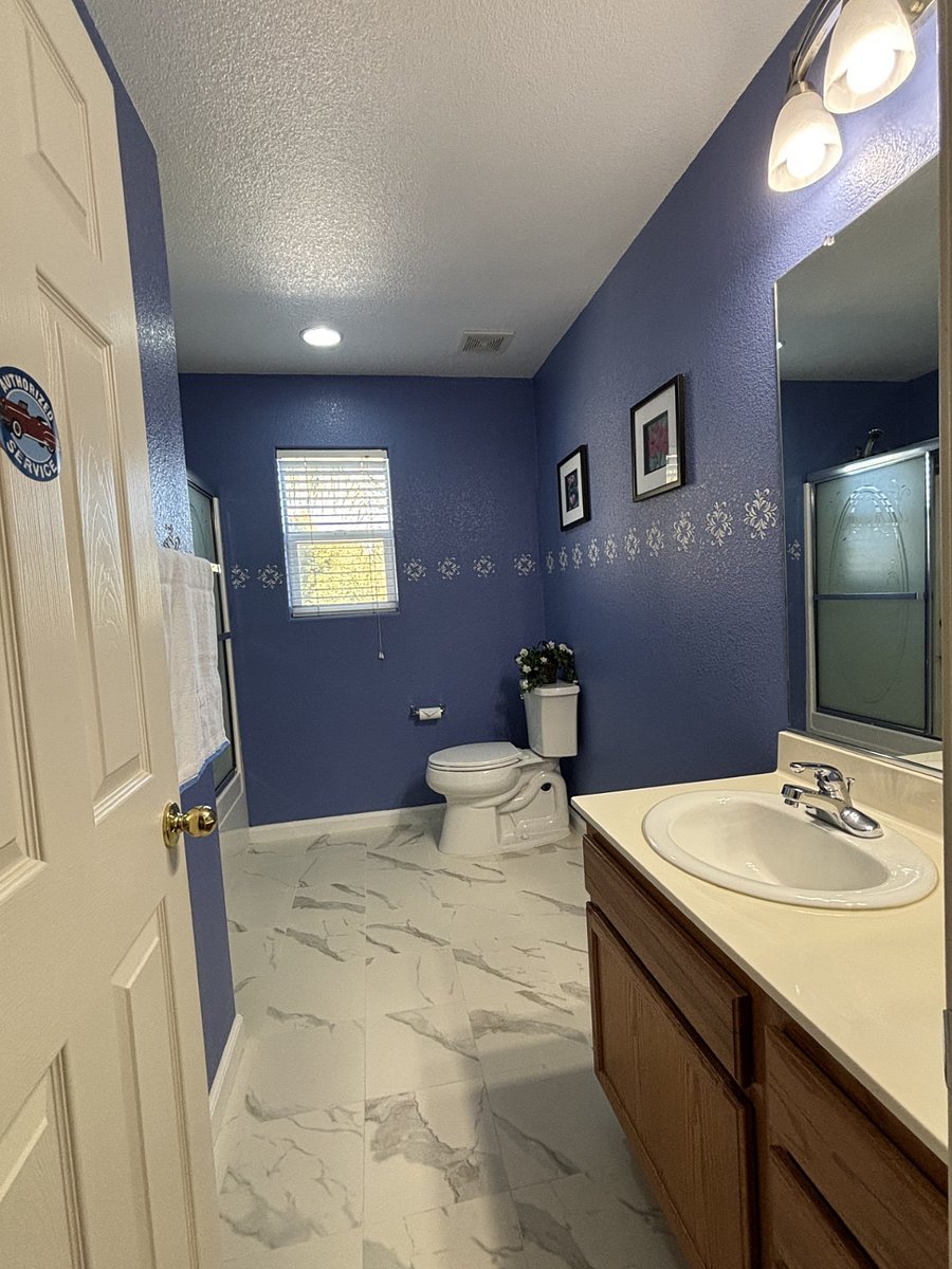 Full bathroom with tub at the hallway upstairs.
