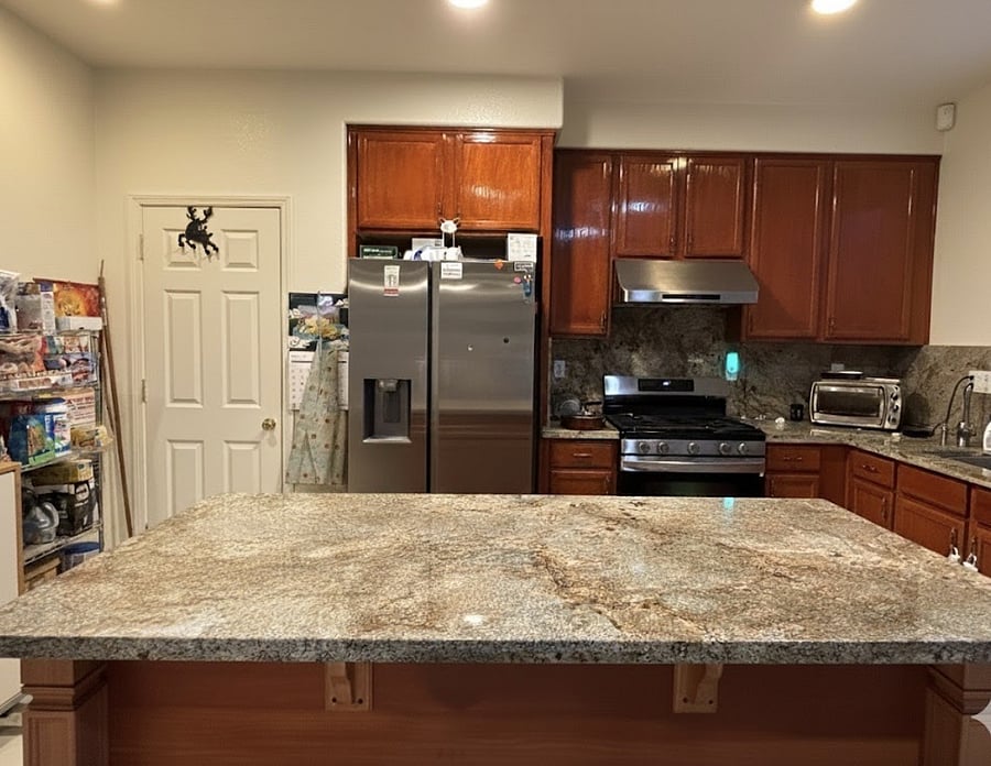 Full kitchen with granite countertop and full backsplash.  Gas range.  Refrigerator with water and ice dispenser at the door.