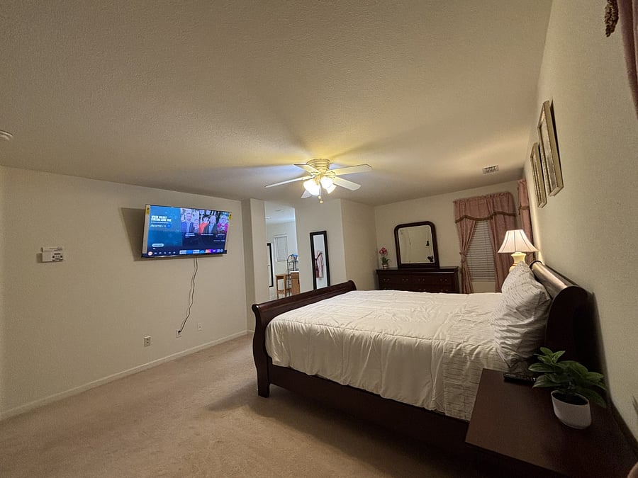 Huge Master bedroom with a Smart TV and a working desk ready for working from home.