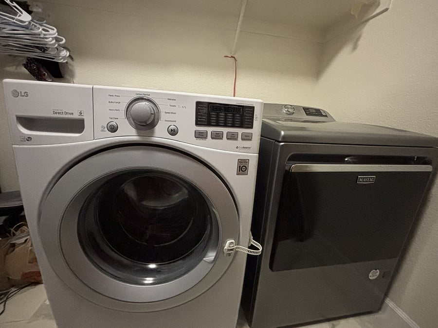 Washer and Dryer inside a laundry room