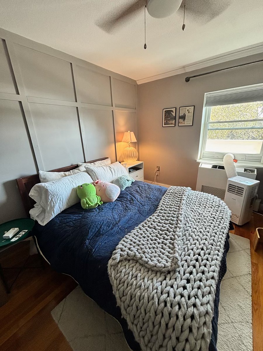 Bedroom with view of the river, and ceiling fan above. Also has built in closet (wall opposite the window) and portable A/C unit (can be removed or installed as/when needed).