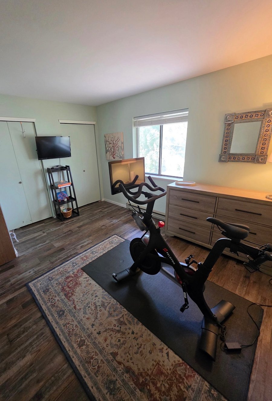 2nd bedroom may be setup
as workout room with use of Peloton bike, weights and yoga mat. 