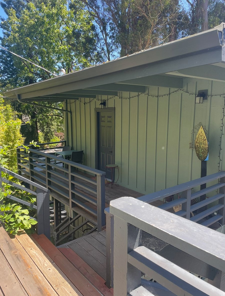 Private, covered deck with table and chairs