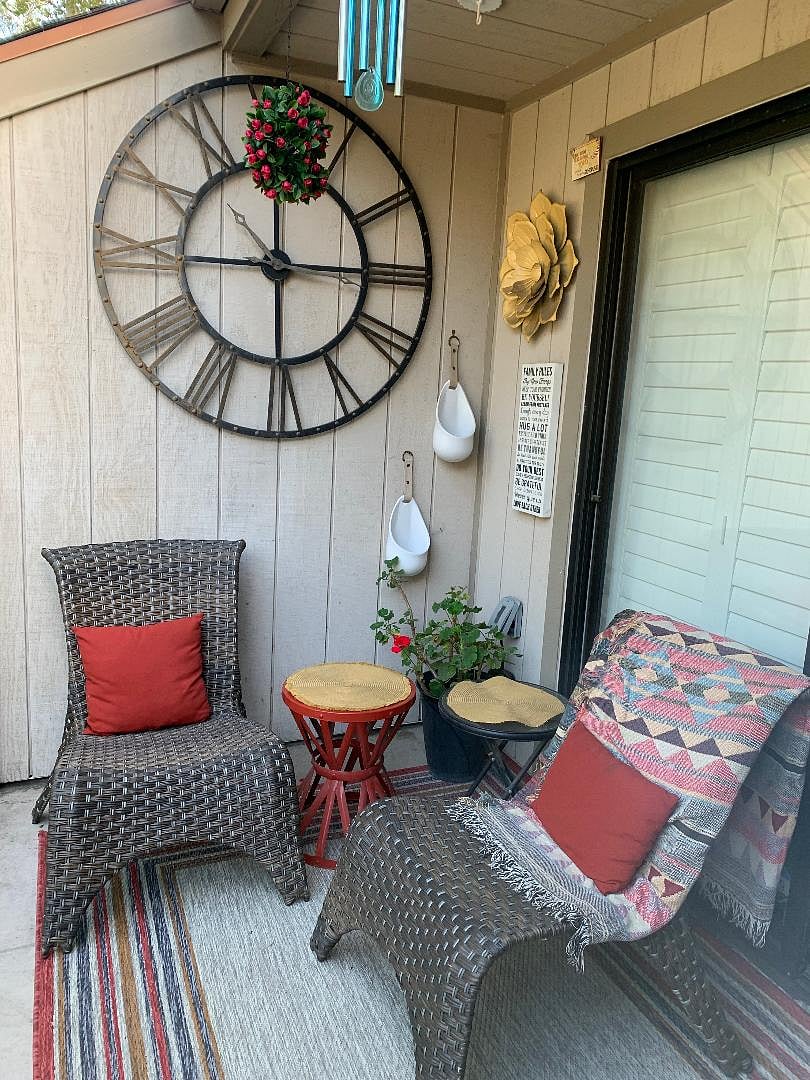Patio. Includes two outdoor chairs and a storage closet.