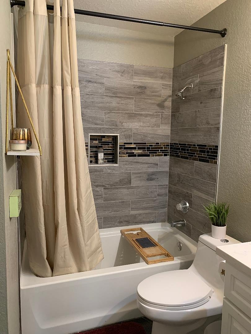 Secondary Bathroom, located directly across from the secondary bedroom. Comes with starter toiletries and bath salts, hair/blow dryer, soaps, towels, and a tub.