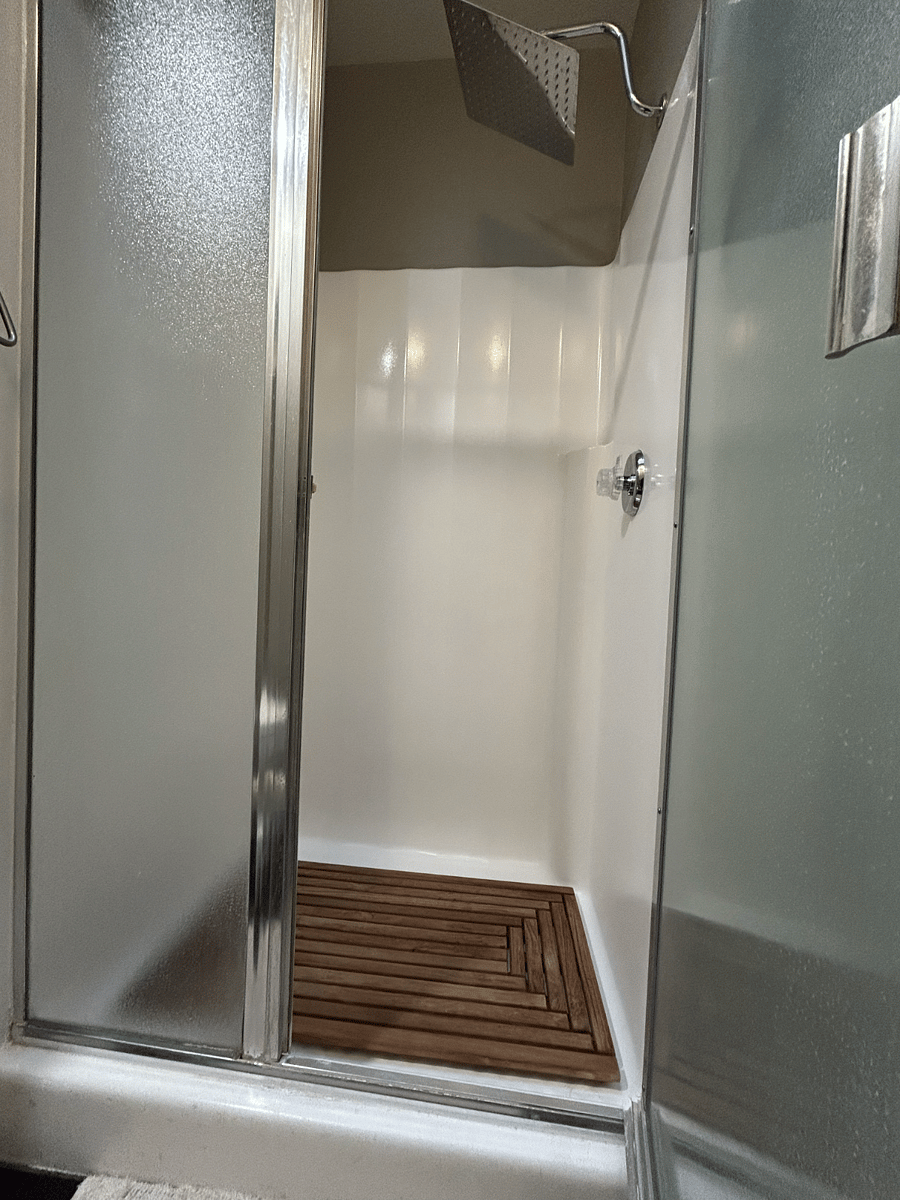 Primary/Master Bedroom shower with rain shower head.