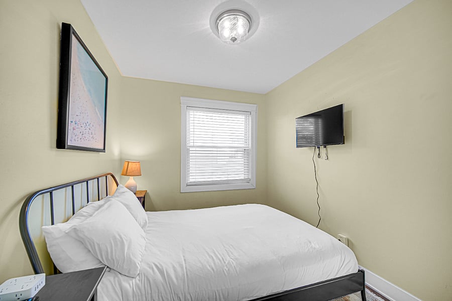 Guest Bedroom 1, smart tv and window view.
