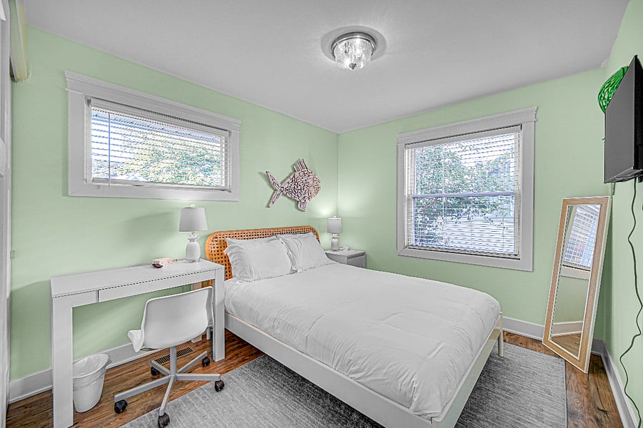 Guest Bedroom 2, with queen bed and desk.