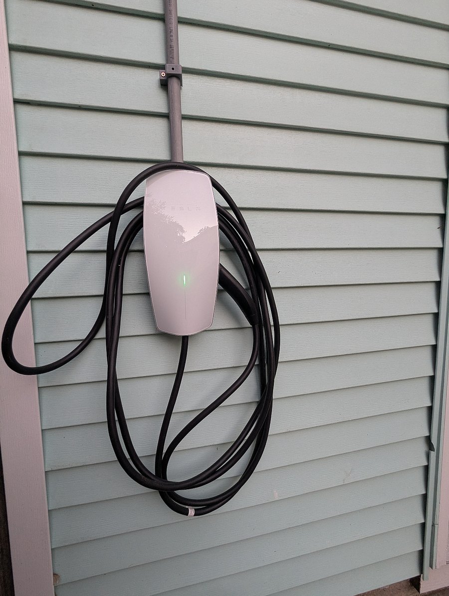 Free driveway parking for multiple vehicles, plus a convenient EV charger for electric vehicles.