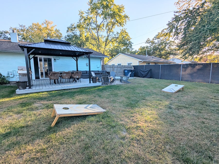 Enjoy friendly competition with tetherball and cornhole on the lush backyard lawn, fun for kids and adults alike!