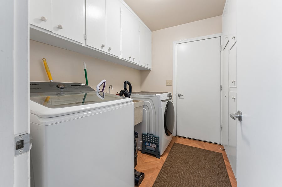 Full laundry room with additional storage