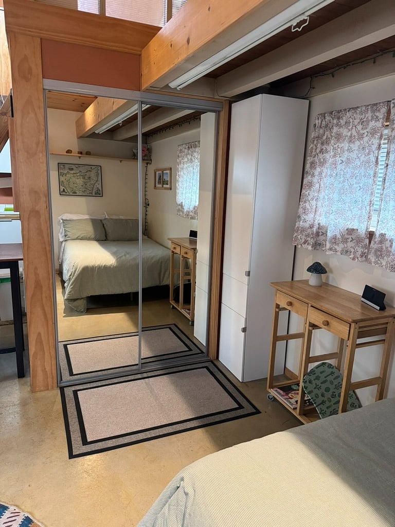 Large closet with mirrors.