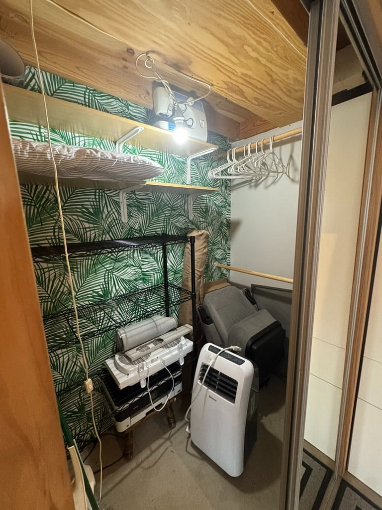 Inside of closet. Portable AC unit.