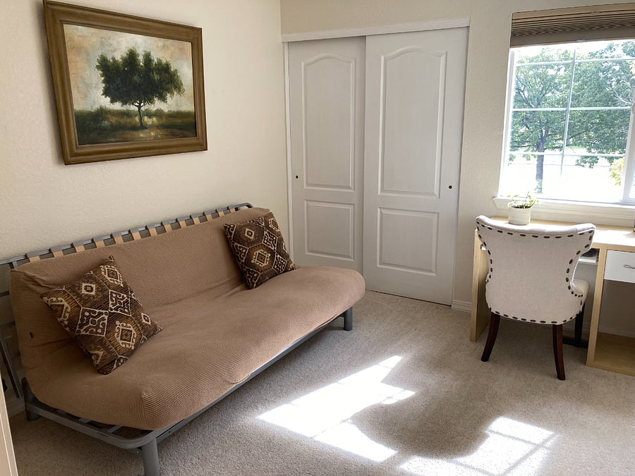 Second bedroom can function as an office or guest room.