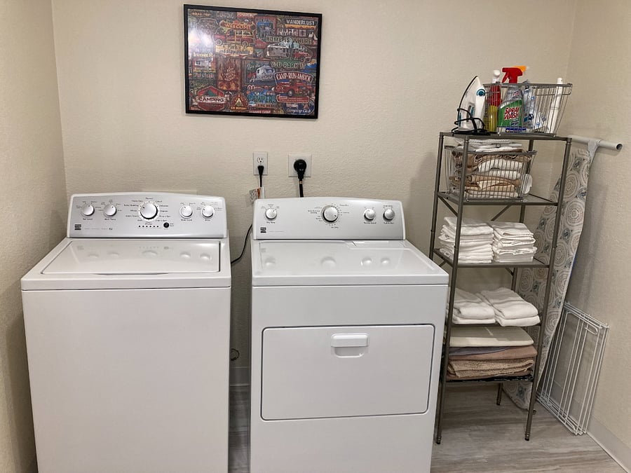 Laundry room has newer washer and dryer.