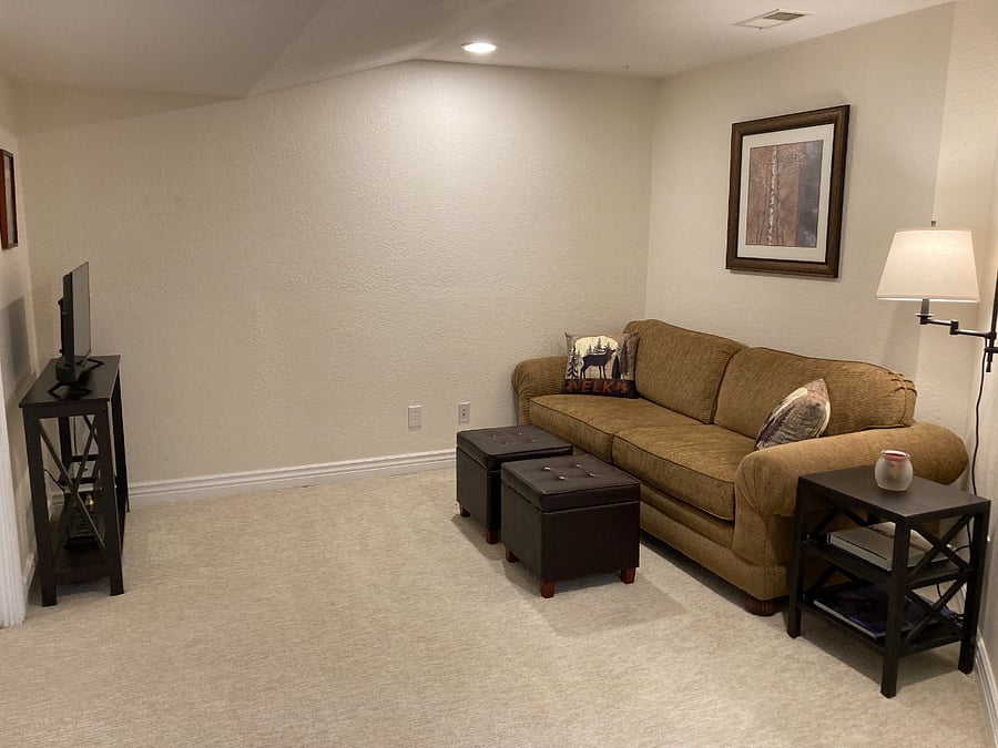 Basement den has a Smart TV.
