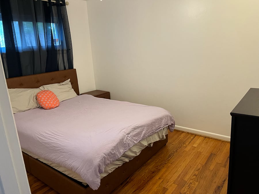 Bedroom #2.  Outfitted with queen sized bed, pillows, sheets, storage baskets under bed, nightstand, dresser and closet.  Located on the south side of the property.  