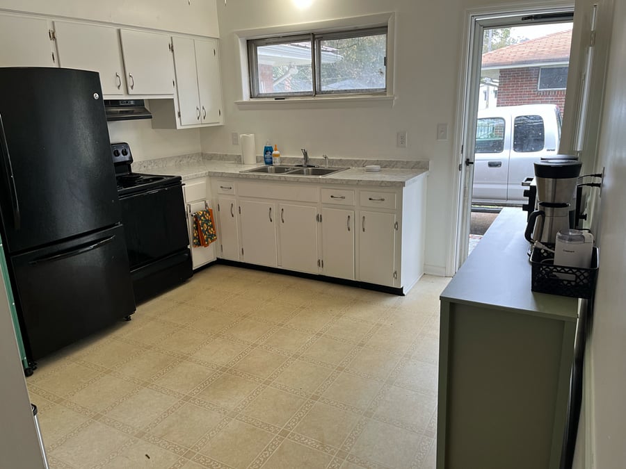Kitchen door, breakfast nook, and pantry. Outfitted with toaster oven, coffee pot, grinder, and silverware. 
